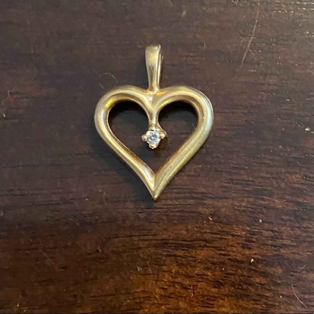 Gold heart necklace charm with center diamond